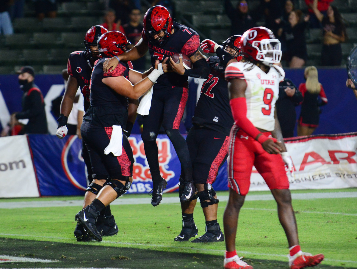 San Diego State Aztecs quarterback Lucas Johnson (7) celebrates after catching a pass for two-point conversion.